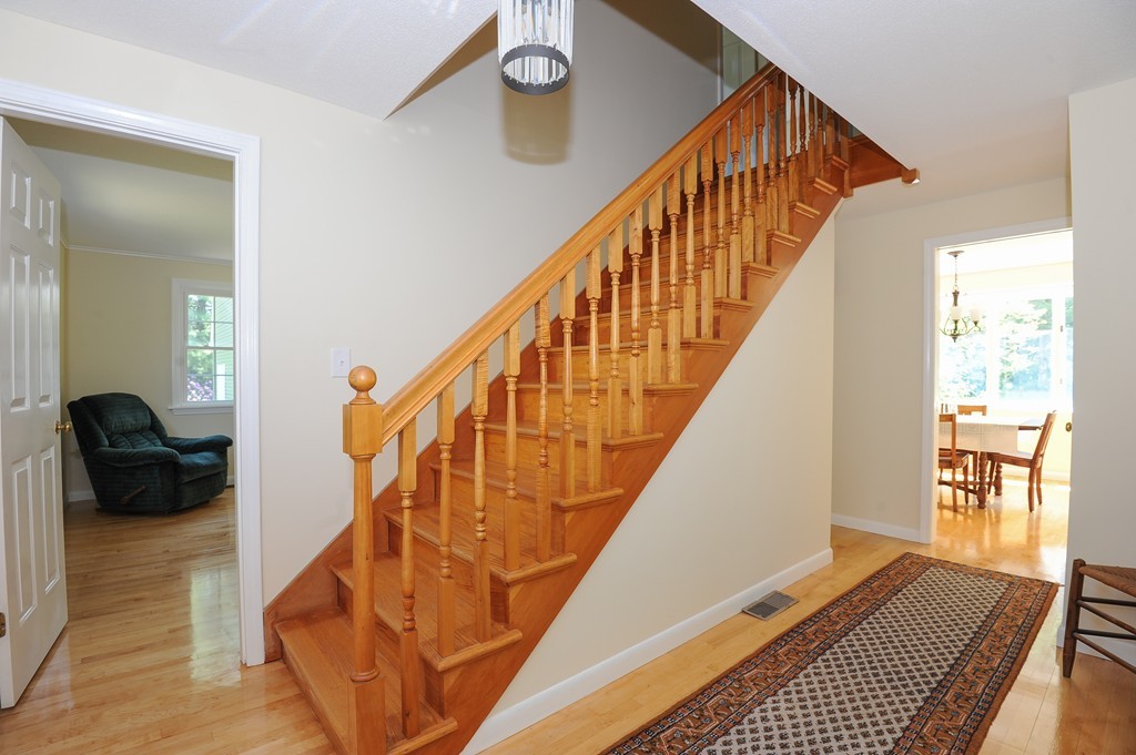 41 Chapel Road Amherst, MA 01002 - Photo 15 of 30 a view of entryway with wooden floor and stairs