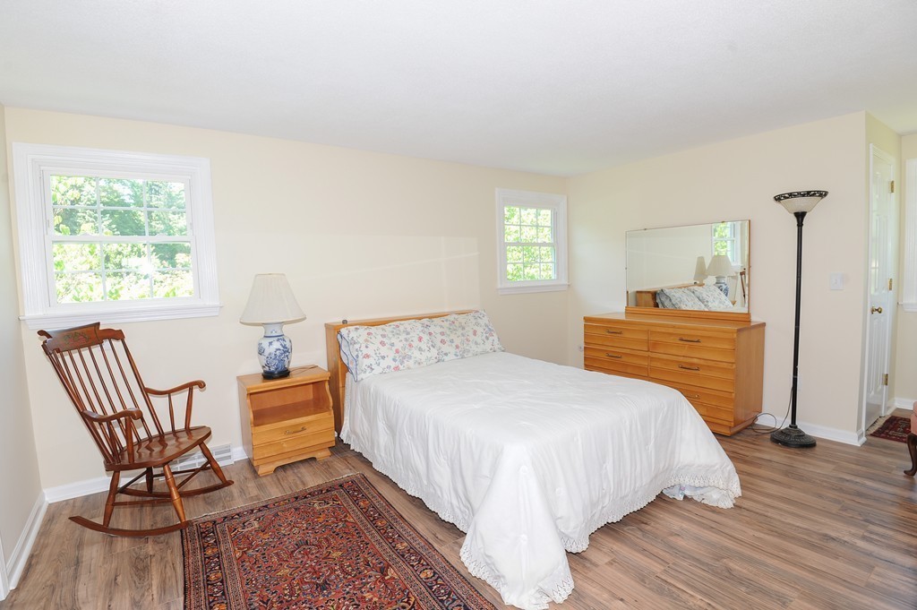 41 Chapel Road Amherst, MA 01002 - Photo 19 of 30 a bedroom with a bed and a chair