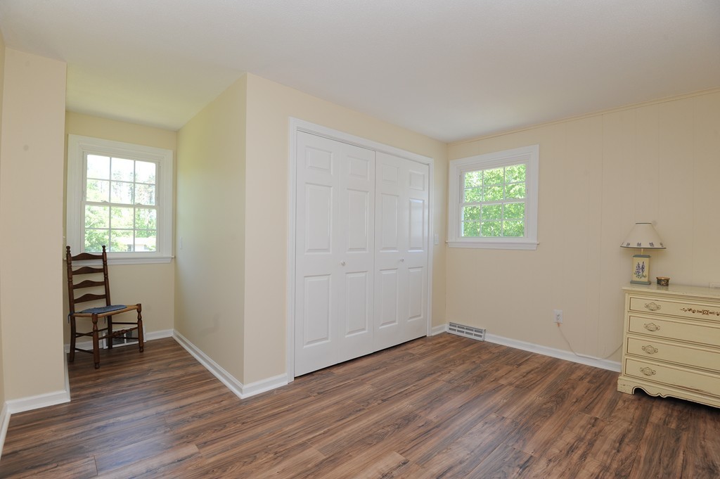 41 Chapel Road Amherst, MA 01002 - Photo 20 of 30 an empty room with wooden floor closet and windows
