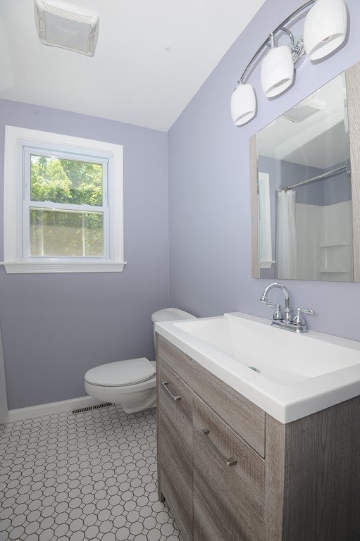 41 Chapel Road Amherst, MA 01002 - Photo 22 of 30 a bathroom with a sink a toilet and a mirror