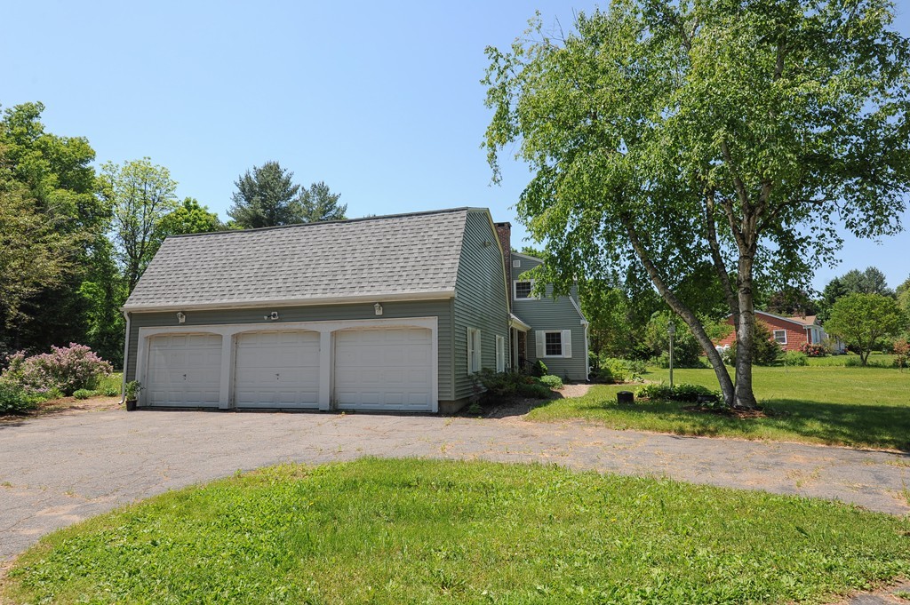 41 Chapel Road Amherst, MA 01002 - Photo 23 of 30 a front view of a house with a yard and garage