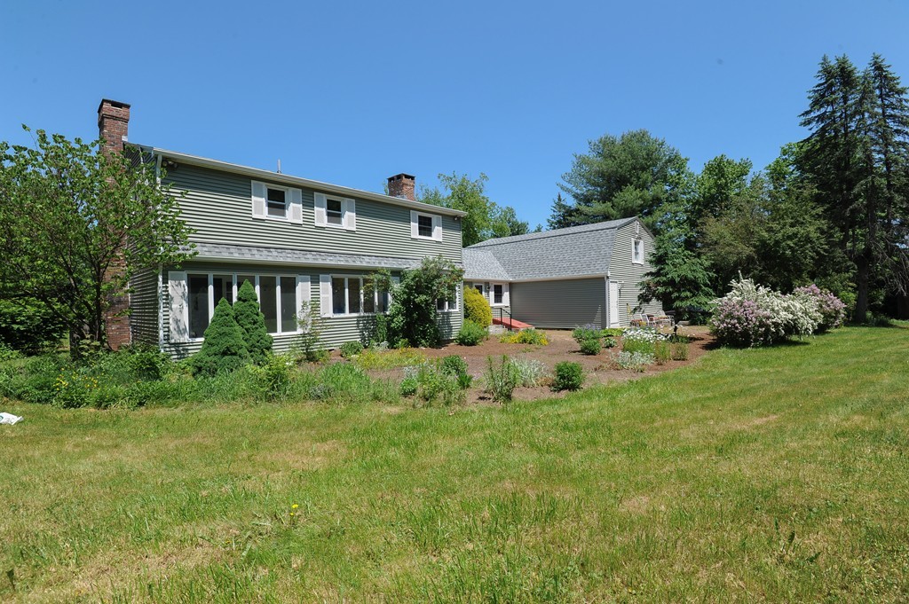 41 Chapel Road Amherst, MA 01002 - Photo 27 of 30 a front view of a house with a garden and yard