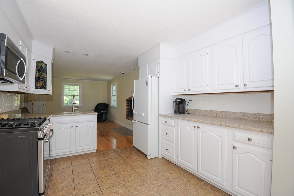 41 Chapel Road Amherst, MA 01002 - Photo 7 of 30 a kitchen with white cabinets and appliances