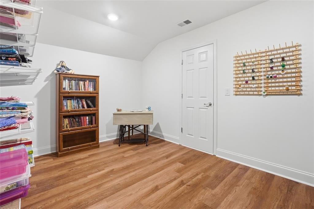 3328 Ivy Ridge Court Buford, GA 30519 - Photo 29 of 34 a view of empty room with furniture and wooden floor