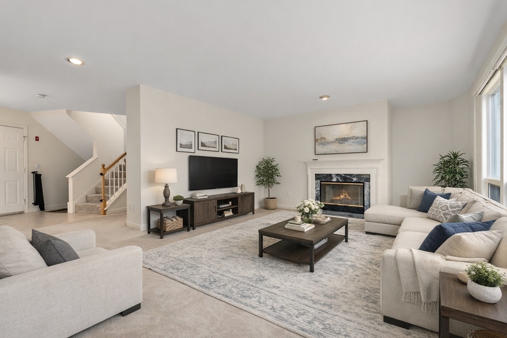 3 Parker Ridge Way, Unit 3 Newburyport, MA 01950 - Photo 2 of 40 a living room with furniture and a flat screen tv