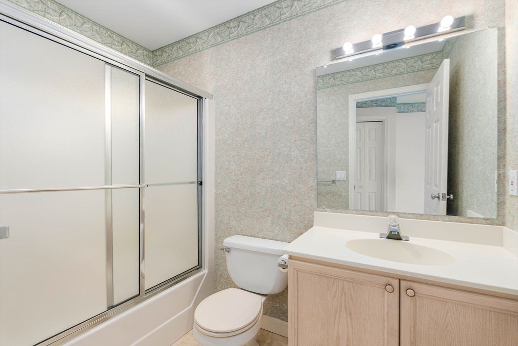 3 Parker Ridge Way, Unit 3 Newburyport, MA 01950 - Photo 22 of 40 a bathroom with a sink a toilet and shower