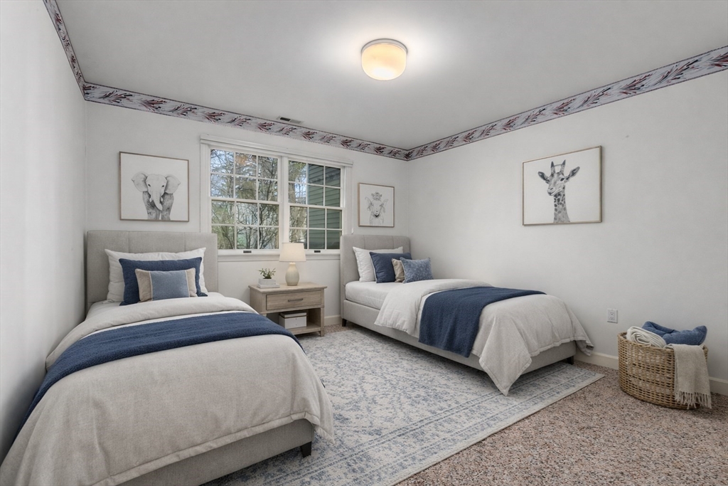 3 Parker Ridge Way, Unit 3 Newburyport, MA 01950 - Photo 26 of 40 a bedroom with two beds and a large window