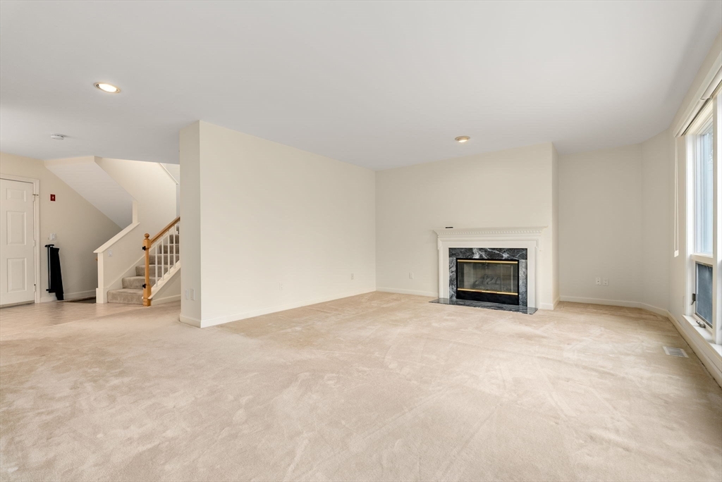 3 Parker Ridge Way, Unit 3 Newburyport, MA 01950 - Photo 3 of 40 a view of an empty room with a fireplace