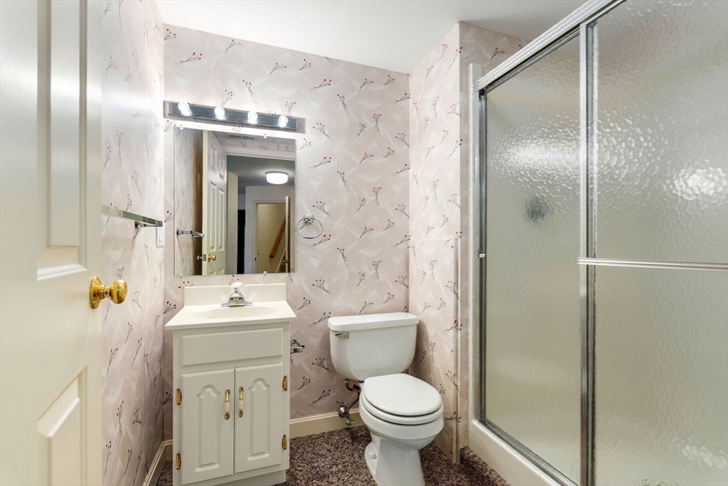 3 Parker Ridge Way, Unit 3 Newburyport, MA 01950 - Photo 31 of 40 a bathroom with a toilet sink and shower