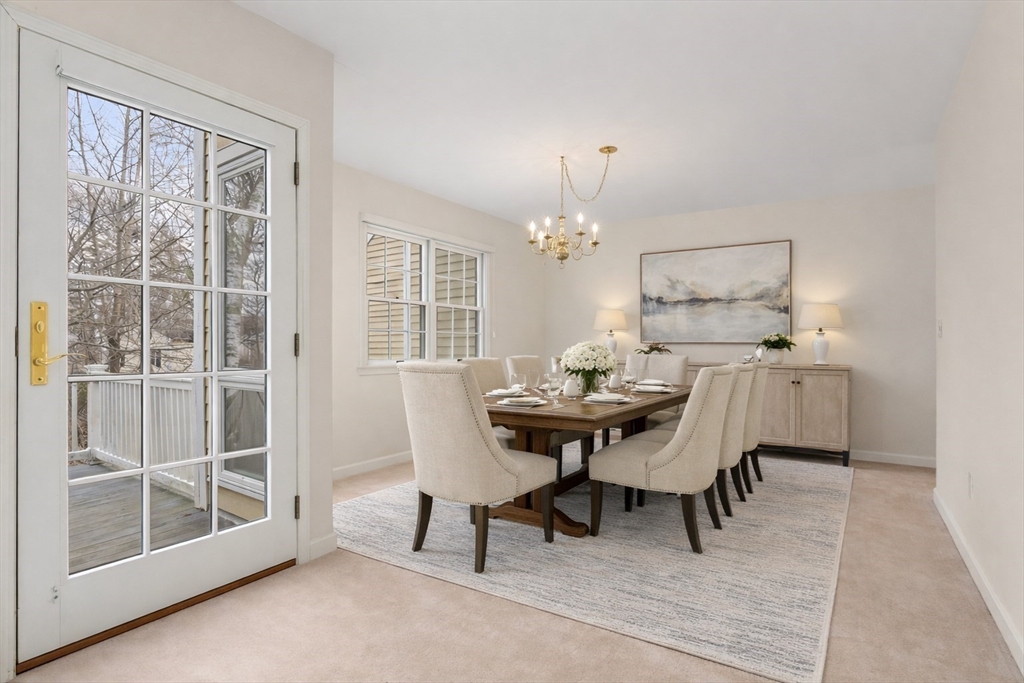 3 Parker Ridge Way, Unit 3 Newburyport, MA 01950 - Photo 4 of 40 a view of a dining room with furniture and chandelier