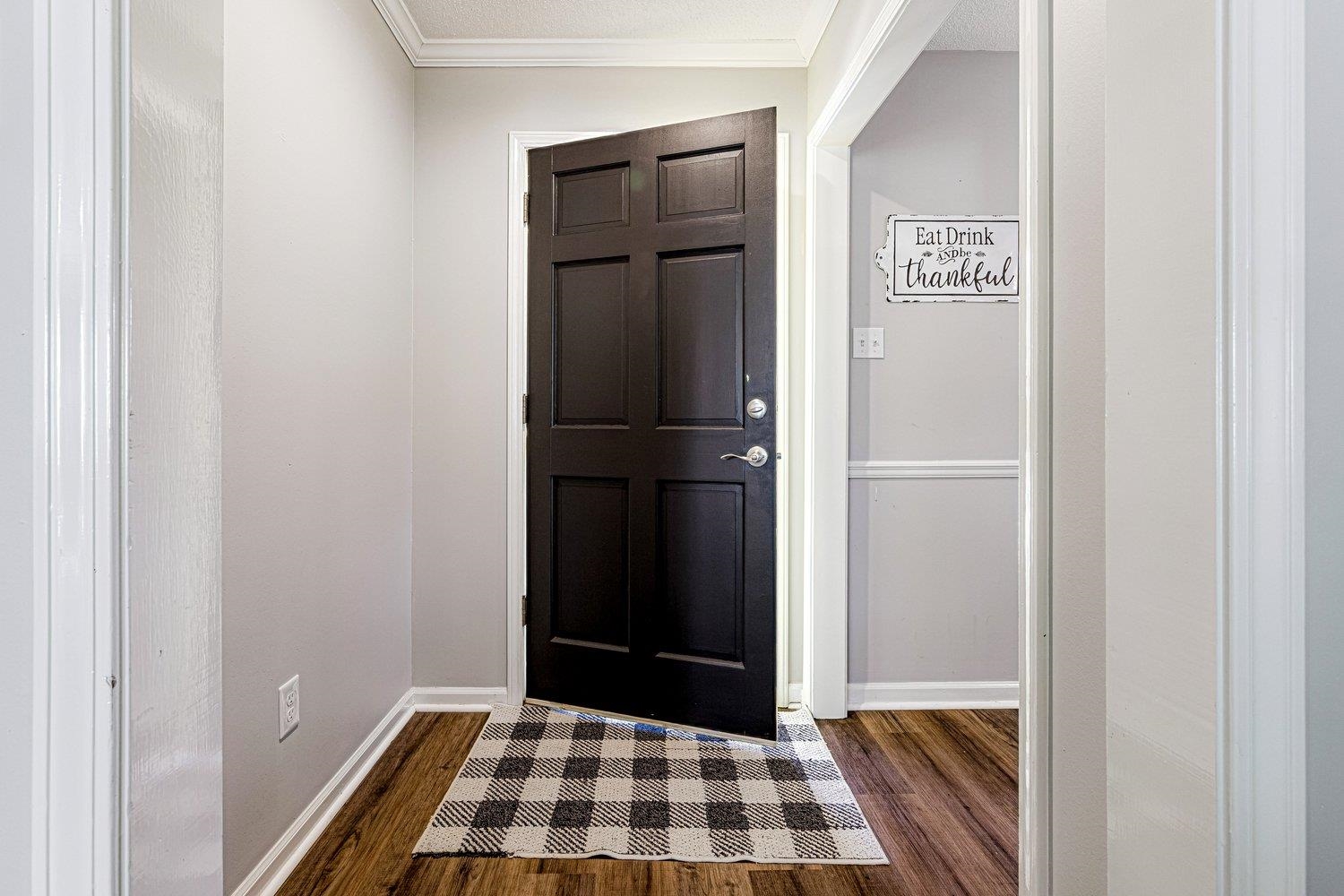 401 North Sanga Road Memphis, TN 38018 - Photo 7 of 27 Entrance foyer with ornamental molding and dark wood-style flooring