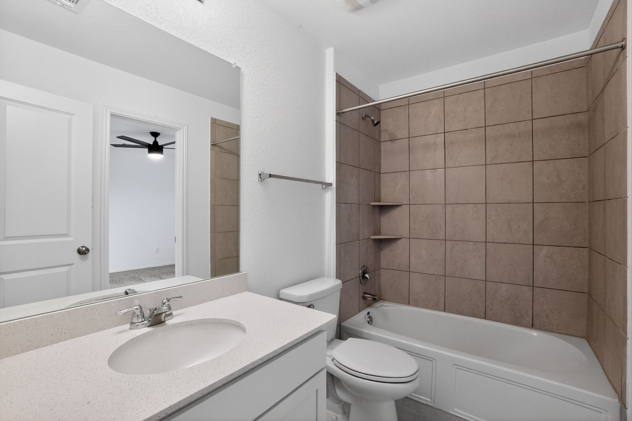 412 Perfect World Loop Jarrell, TX 76537 - Photo 13 of 15 Bathroom featuring a white vanity with a light-colored countertop, an undermount sink, and a chrome faucet