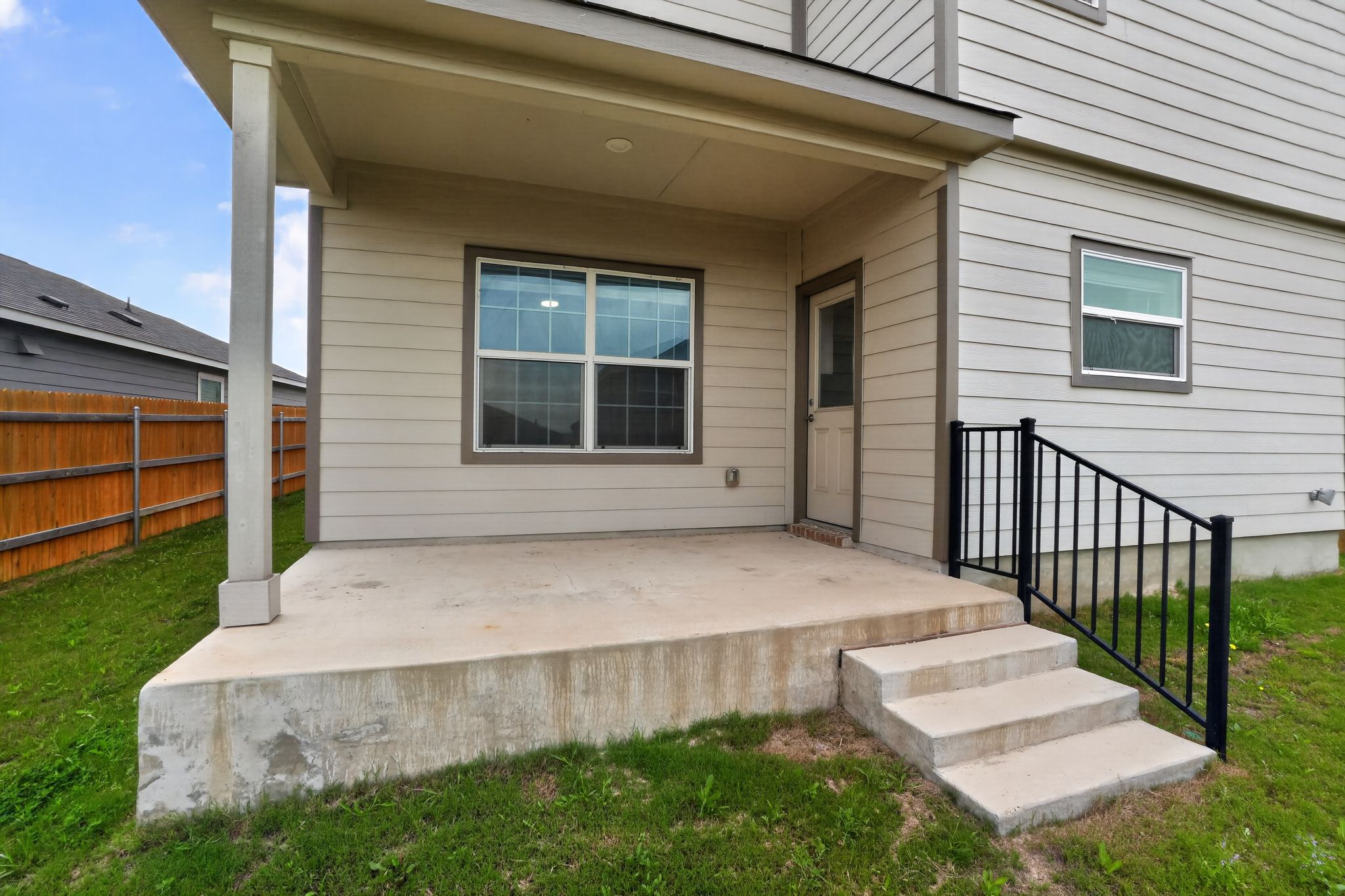 412 Perfect World Loop Jarrell, TX 76537 - Photo 14 of 15 Covered patio with concrete flooring, supported by a square column