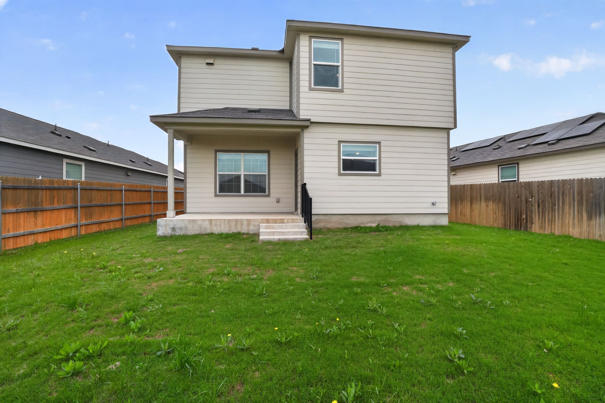412 Perfect World Loop Jarrell, TX 76537 - Photo 15 of 15 Two-story residence featuring light-toned siding and a covered patio