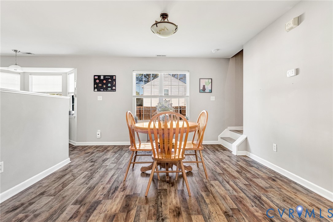 2702 Amherst Ridge Loop Colonial Heights, VA 23834 - Photo 12 of 38 a view of a dining room with furniture and wooden floor