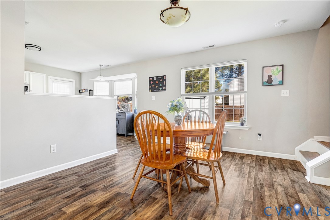 2702 Amherst Ridge Loop Colonial Heights, VA 23834 - Photo 13 of 38 a view of a dining room with furniture and wooden floor