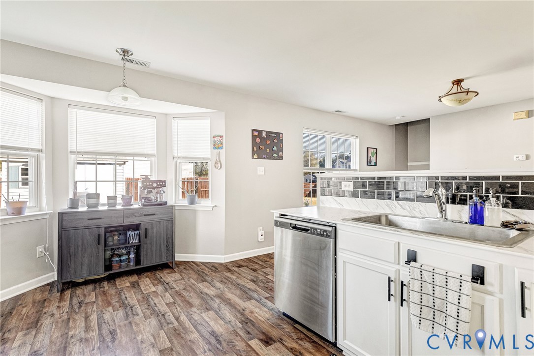 2702 Amherst Ridge Loop Colonial Heights, VA 23834 - Photo 16 of 38 a kitchen with stainless steel appliances granite countertop a sink stove and refrigerator