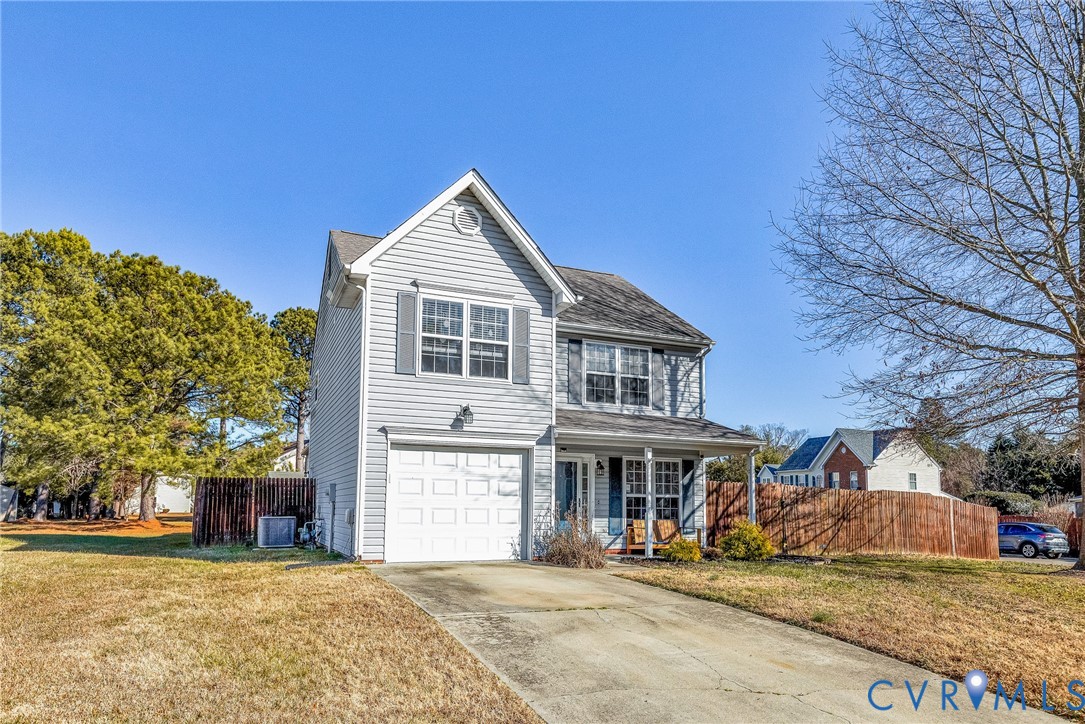 2702 Amherst Ridge Loop Colonial Heights, VA 23834 - Photo 2 of 38 a front view of a house with a yard