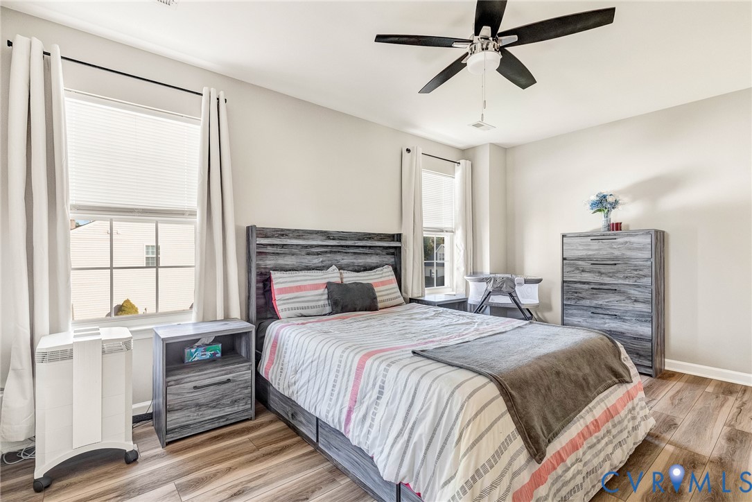 2702 Amherst Ridge Loop Colonial Heights, VA 23834 - Photo 21 of 38 a bedroom with a bed and a window