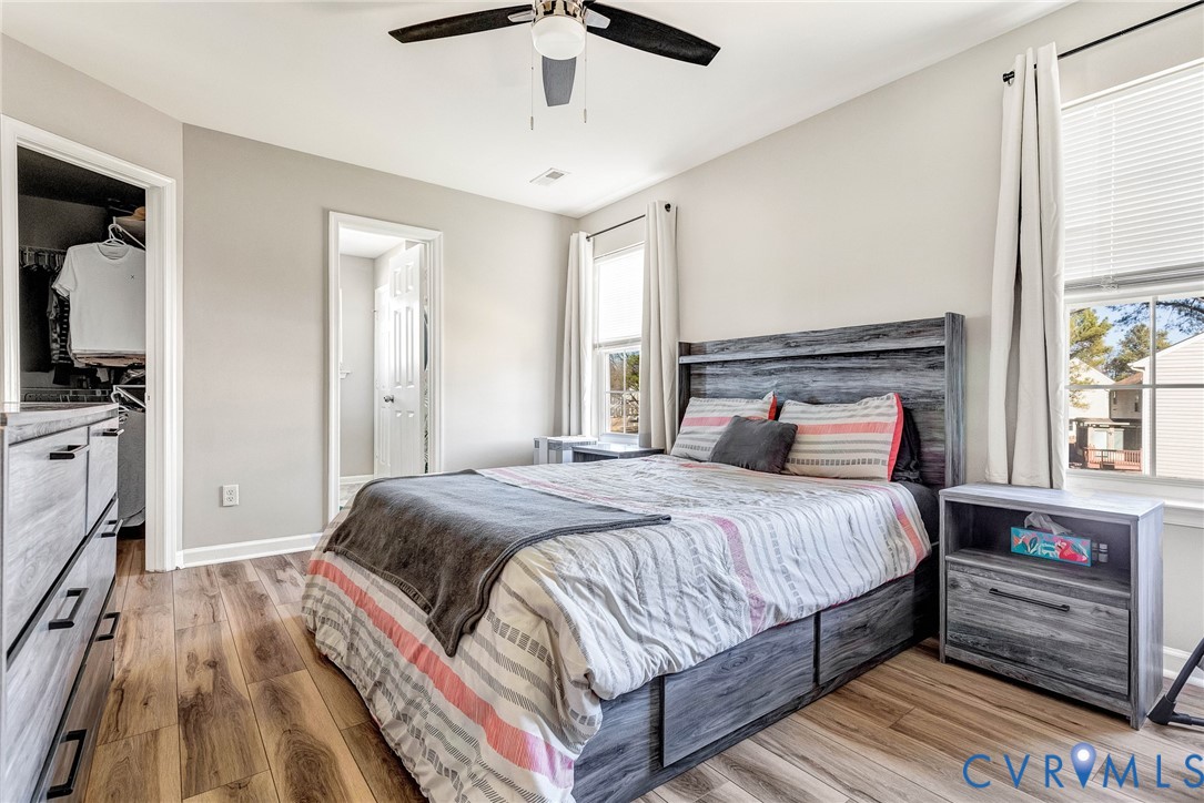 2702 Amherst Ridge Loop Colonial Heights, VA 23834 - Photo 23 of 38 a bedroom with a bed and a flat tv screen on dresser