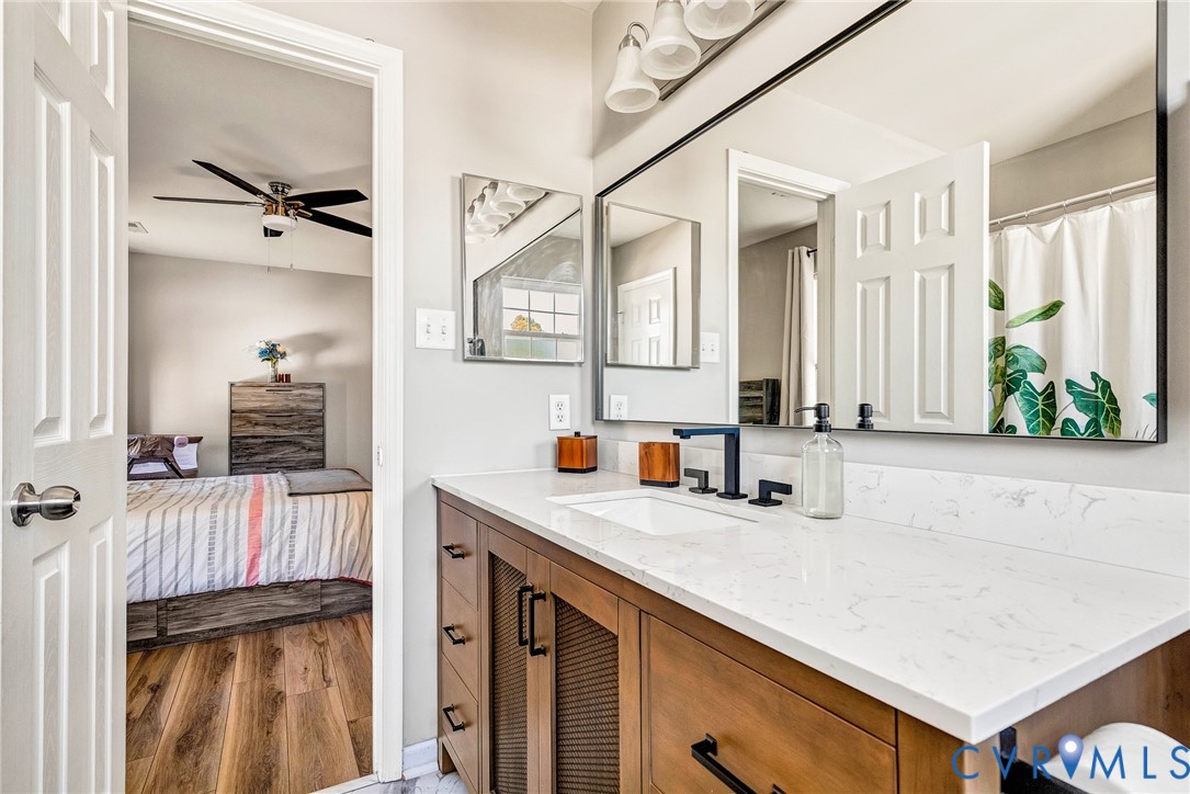 2702 Amherst Ridge Loop Colonial Heights, VA 23834 - Photo 24 of 38 a kitchen with a sink a stove and a refrigerator