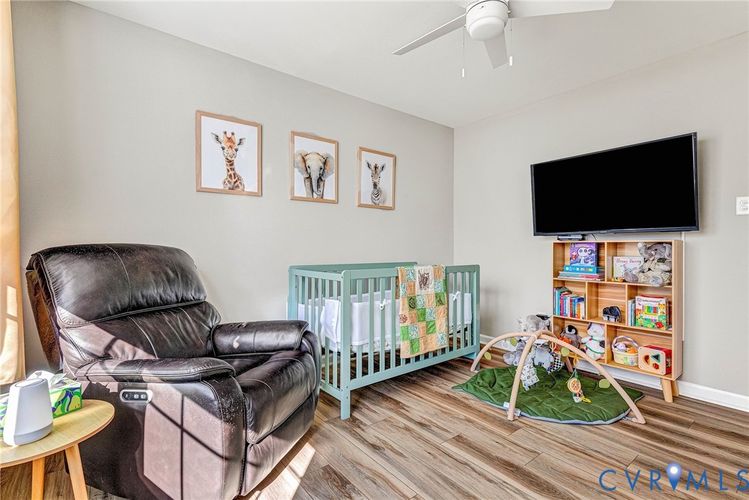 2702 Amherst Ridge Loop Colonial Heights, VA 23834 - Photo 27 of 38 a living room with furniture and a flat screen tv