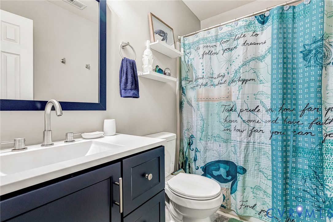 2702 Amherst Ridge Loop Colonial Heights, VA 23834 - Photo 29 of 38 a bathroom with a sink toilet and shower