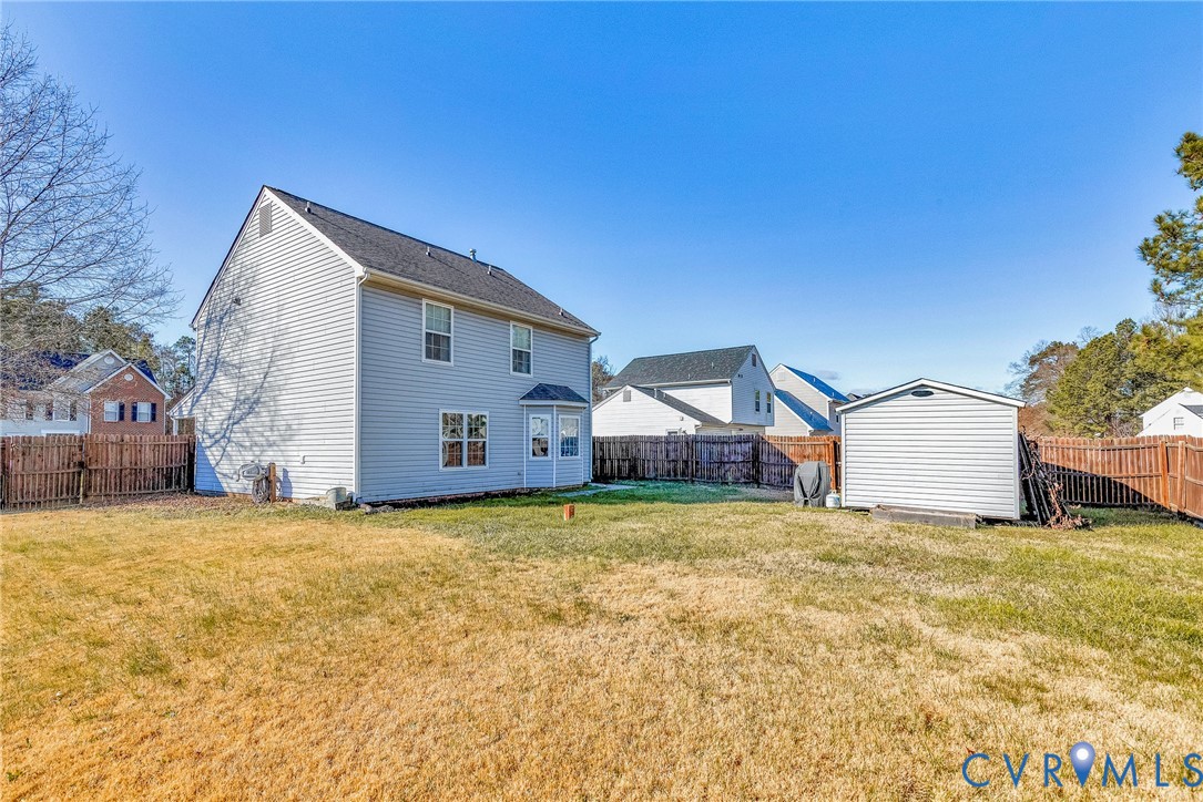 2702 Amherst Ridge Loop Colonial Heights, VA 23834 - Photo 35 of 38 a view of a house with a yard
