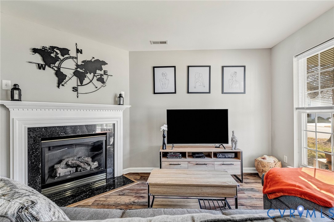 2702 Amherst Ridge Loop Colonial Heights, VA 23834 - Photo 5 of 38 a living room with furniture and a fireplace