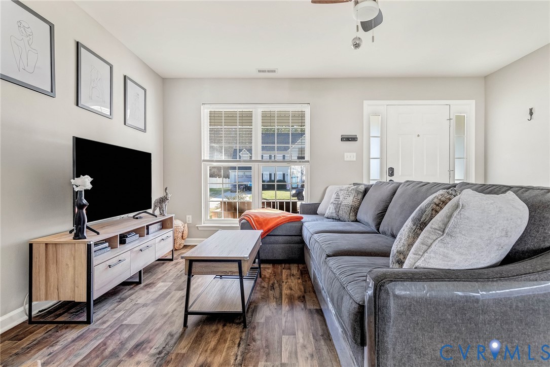 2702 Amherst Ridge Loop Colonial Heights, VA 23834 - Photo 6 of 38 a living room with furniture and a flat screen tv