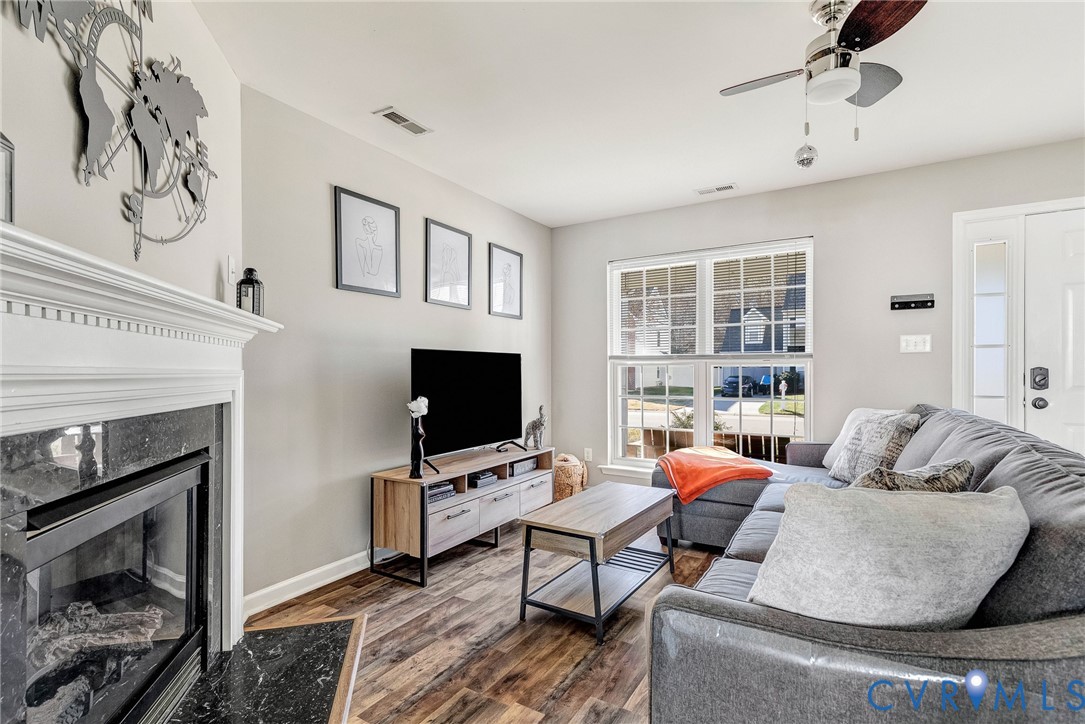 2702 Amherst Ridge Loop Colonial Heights, VA 23834 - Photo 7 of 38 a living room with furniture and a flat screen tv