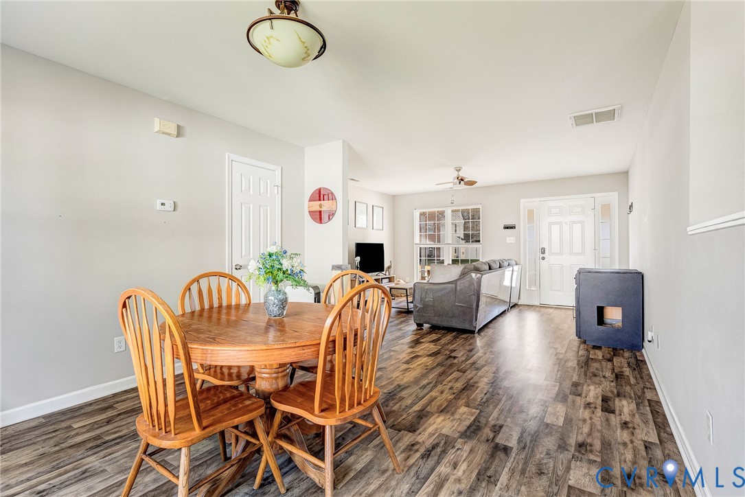 2702 Amherst Ridge Loop Colonial Heights, VA 23834 - Photo 10 of 38 a view of a dining room with furniture and wooden floor