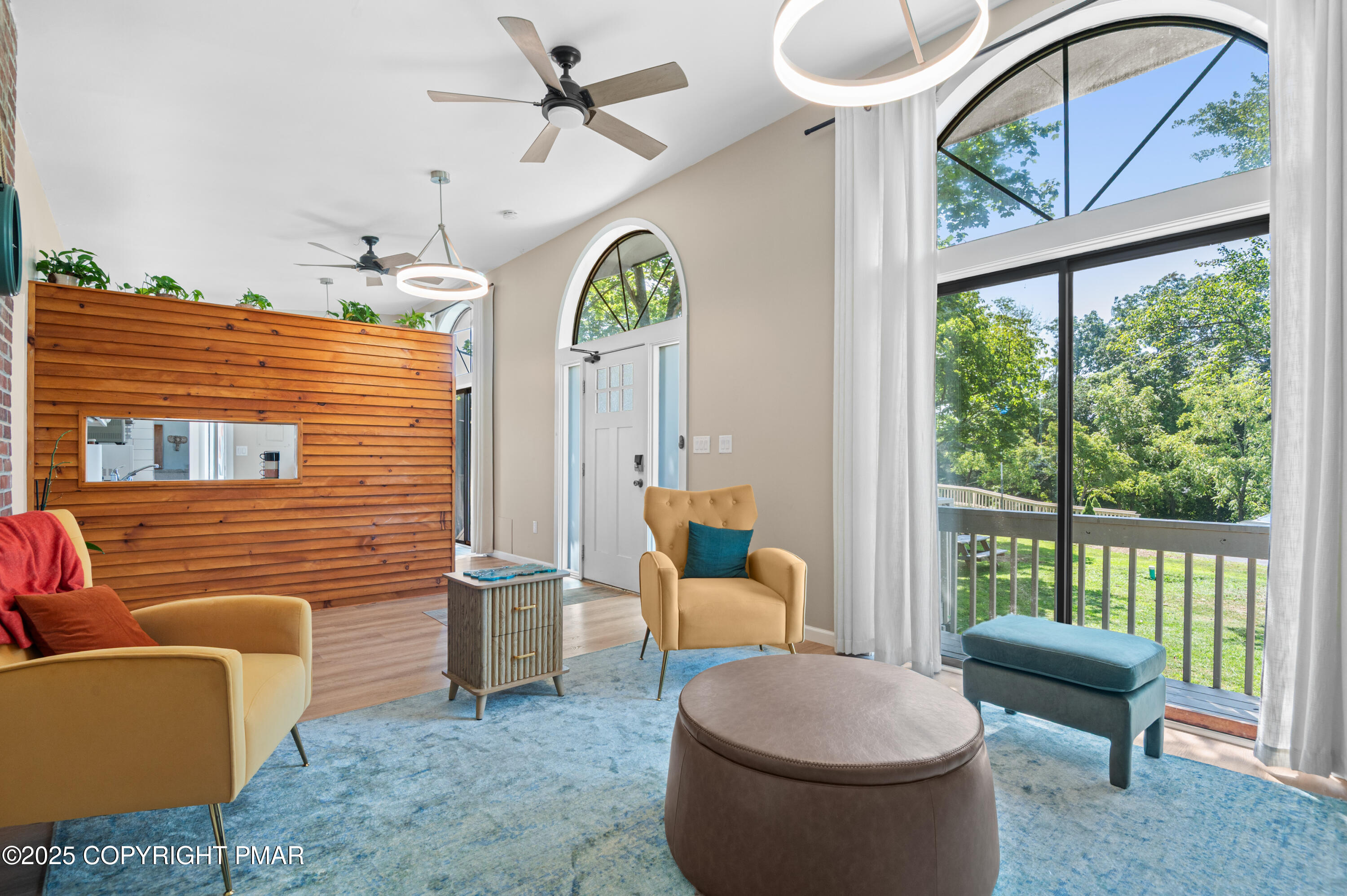 624 Westlake Drive East Stroudsburg, PA 18302 - Photo 110 of 115 a living room with furniture a fireplace and a floor to ceiling window