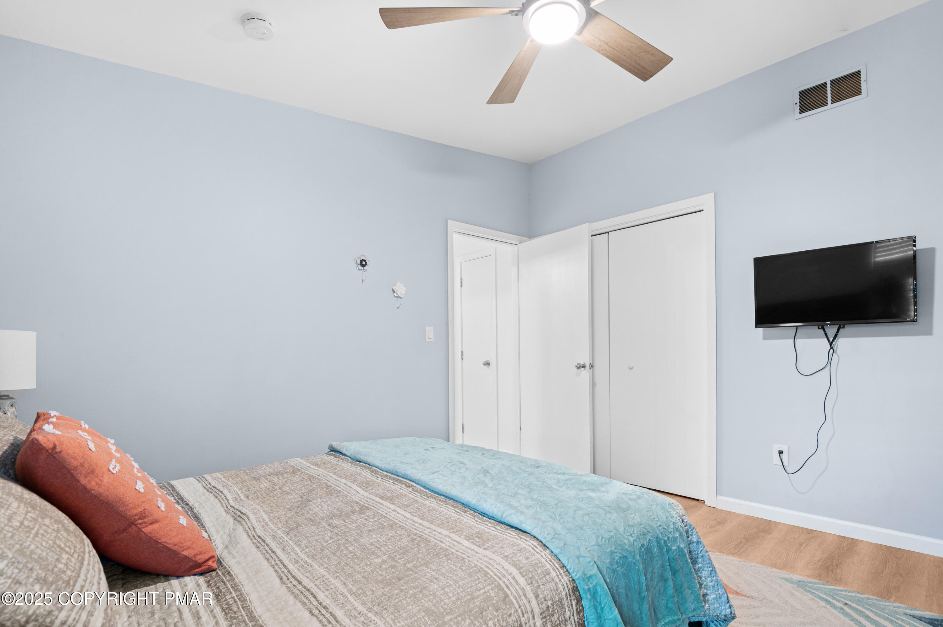 624 Westlake Drive East Stroudsburg, PA 18302 - Photo 115 of 115 a bedroom with a bed and a flat screen tv