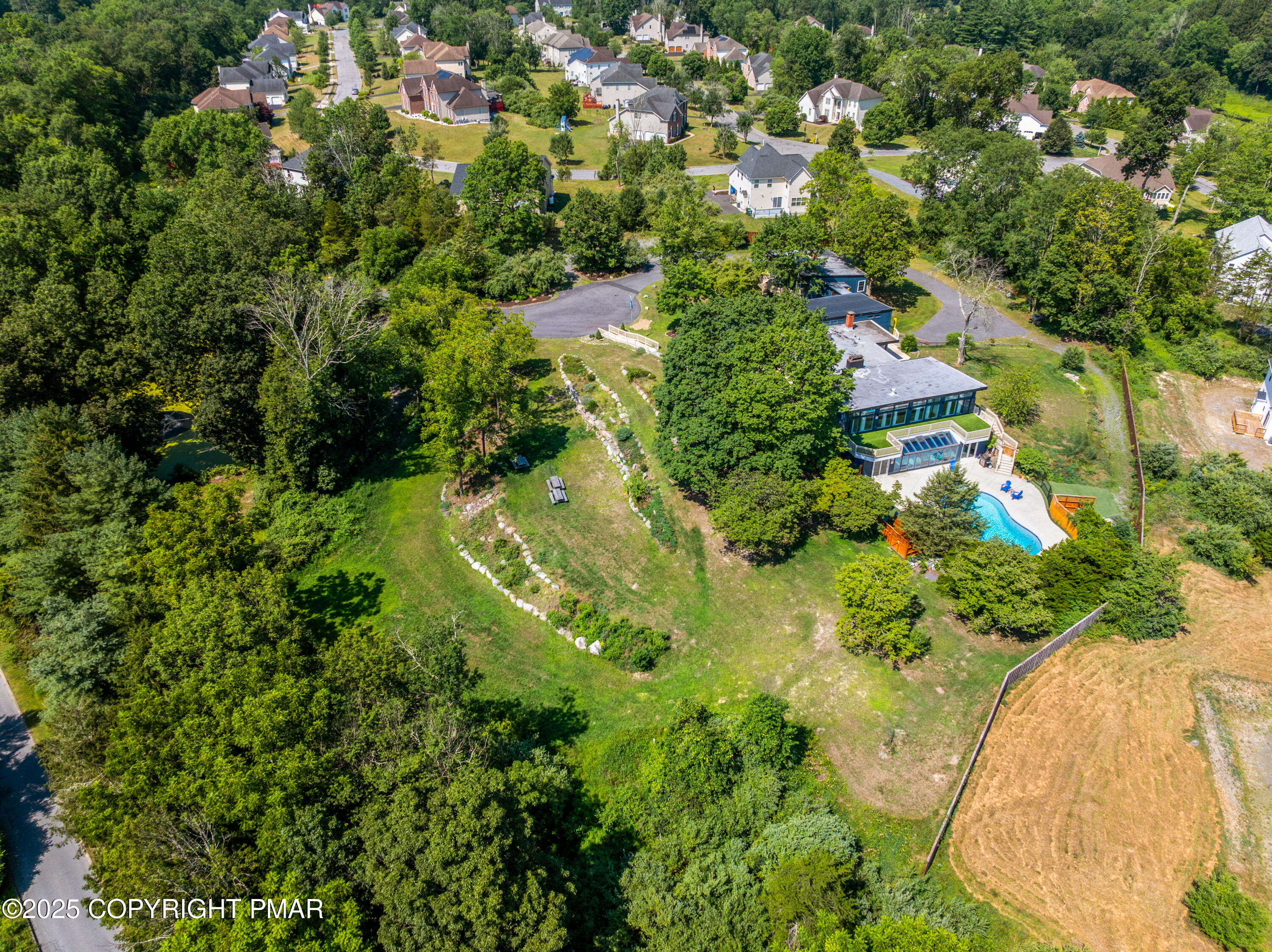 624 Westlake Drive East Stroudsburg, PA 18302 - Photo 20 of 115 an aerial view of residential houses with outdoor space and trees