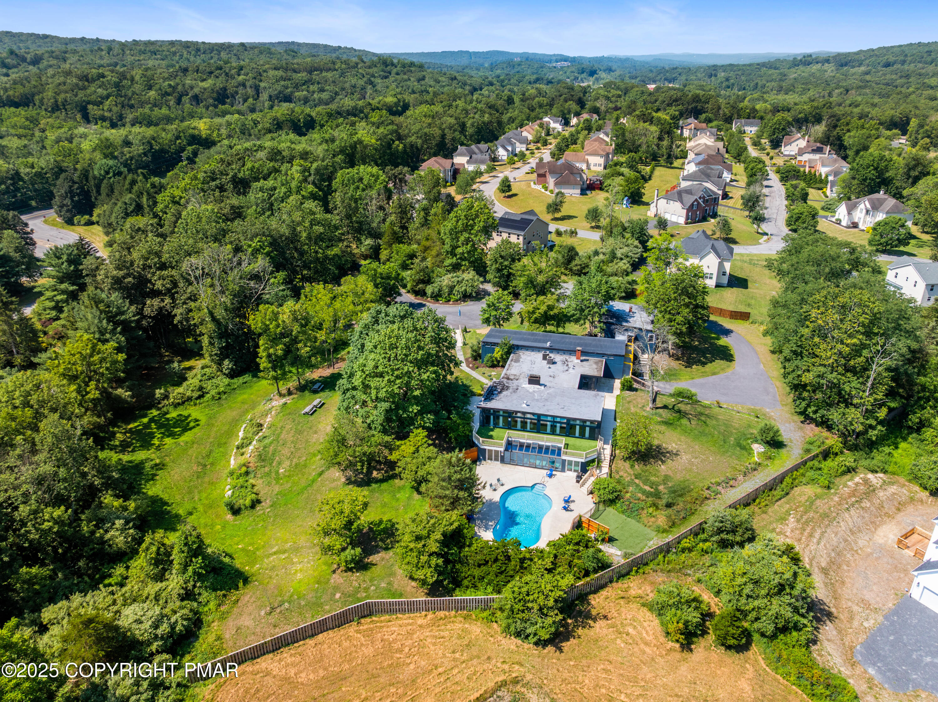 624 Westlake Drive East Stroudsburg, PA 18302 - Photo 21 of 115 an aerial view of residential houses with outdoor space and trees
