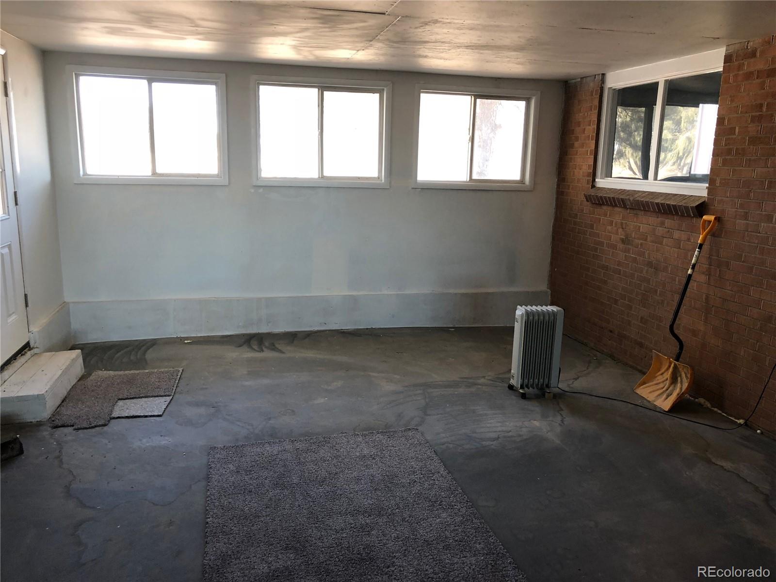 39592 County Road 18 Roggen, CO 80652 - Photo 13 of 34 a view of an empty room with a window