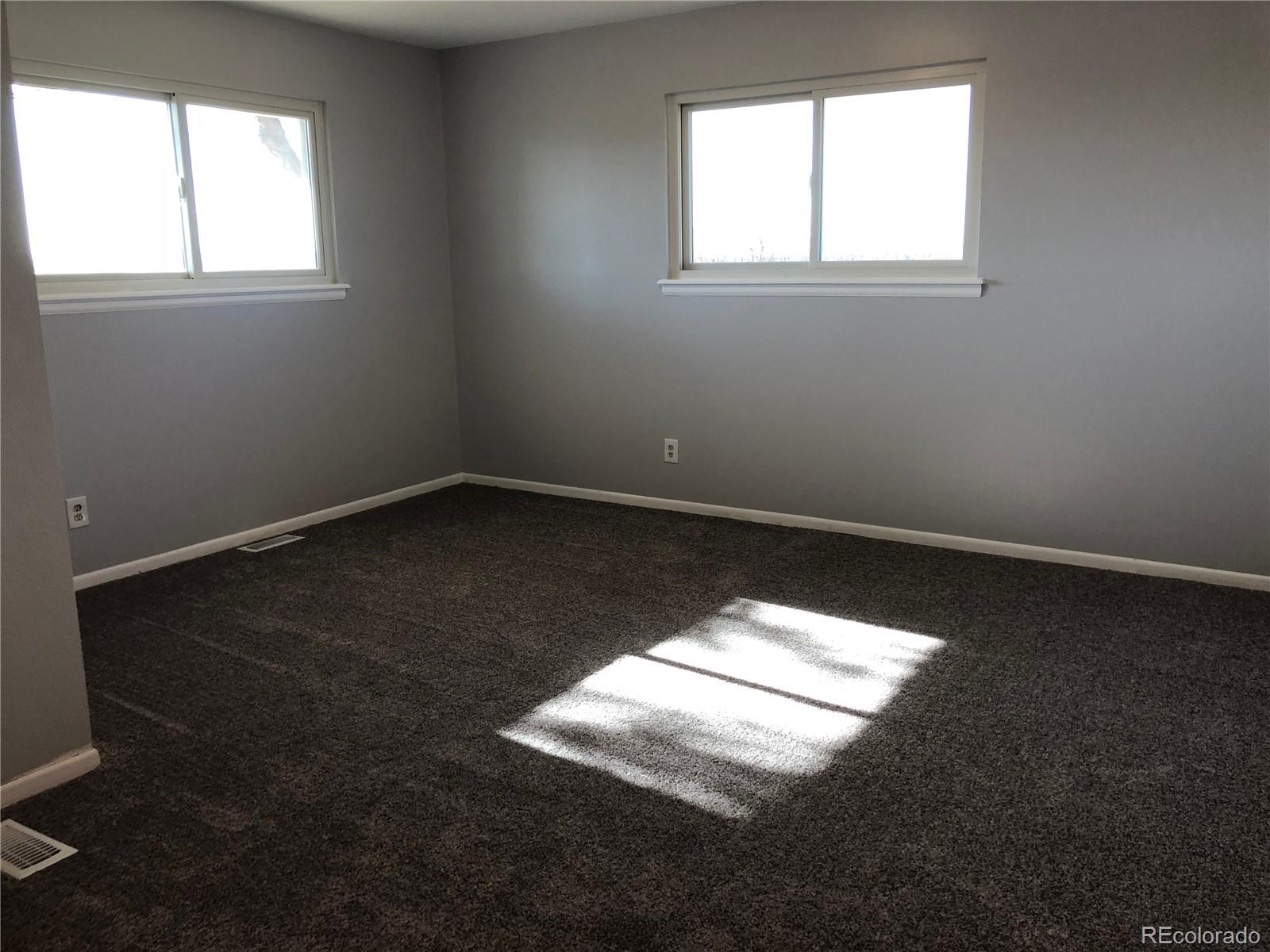 39592 County Road 18 Roggen, CO 80652 - Photo 14 of 34 an empty room with a window