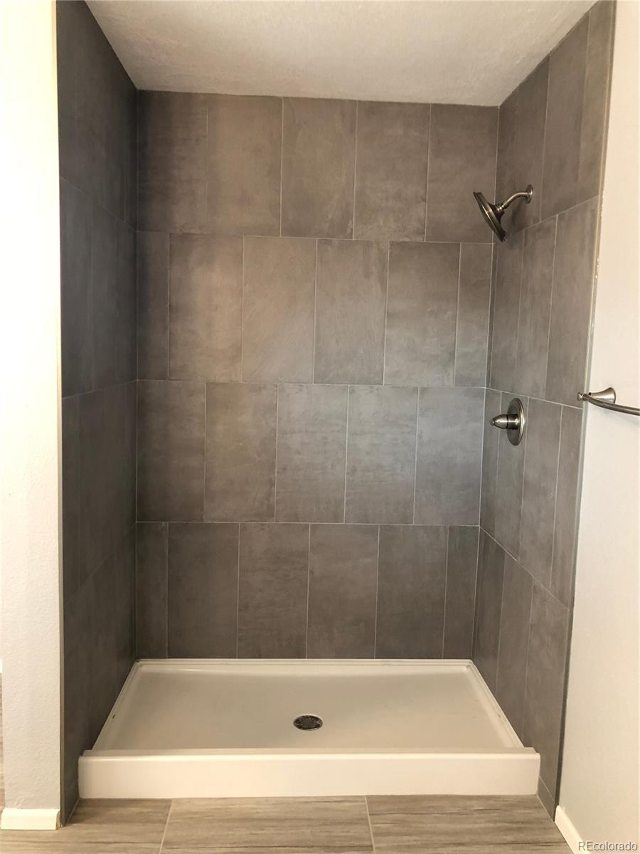 39592 County Road 18 Roggen, CO 80652 - Photo 16 of 34 a bathroom with a bathtub