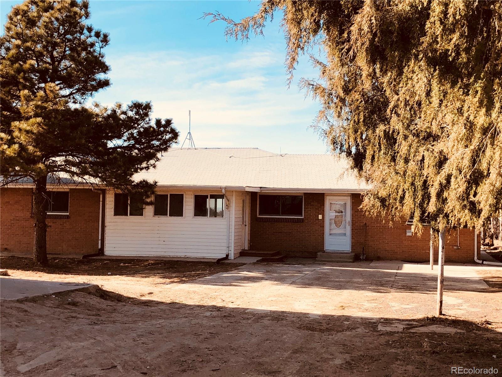 39592 County Road 18 Roggen, CO 80652 - Photo 2 of 34 a view of a house with a yard