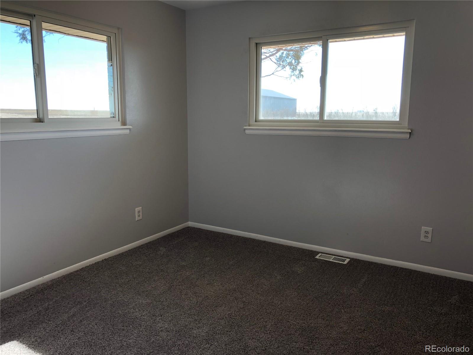 39592 County Road 18 Roggen, CO 80652 - Photo 21 of 34 an empty room with a window