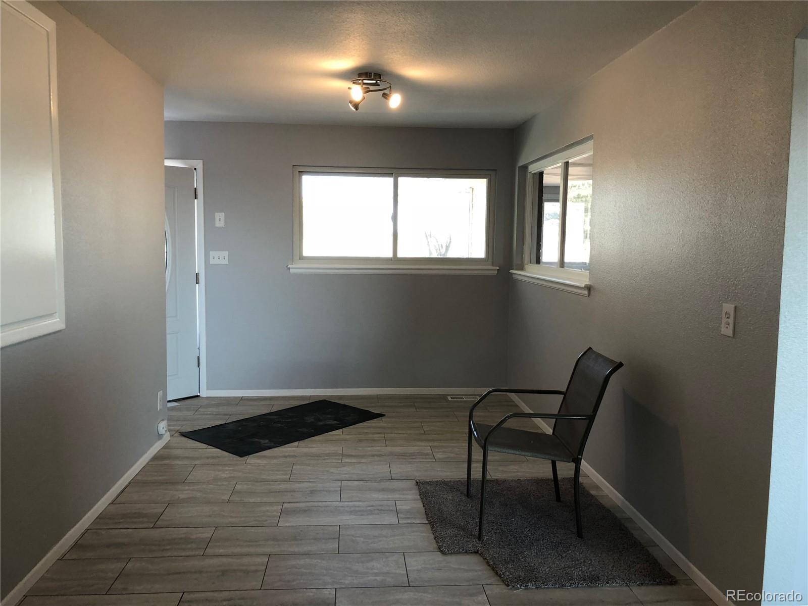 39592 County Road 18 Roggen, CO 80652 - Photo 23 of 34 a view of an empty room with a window
