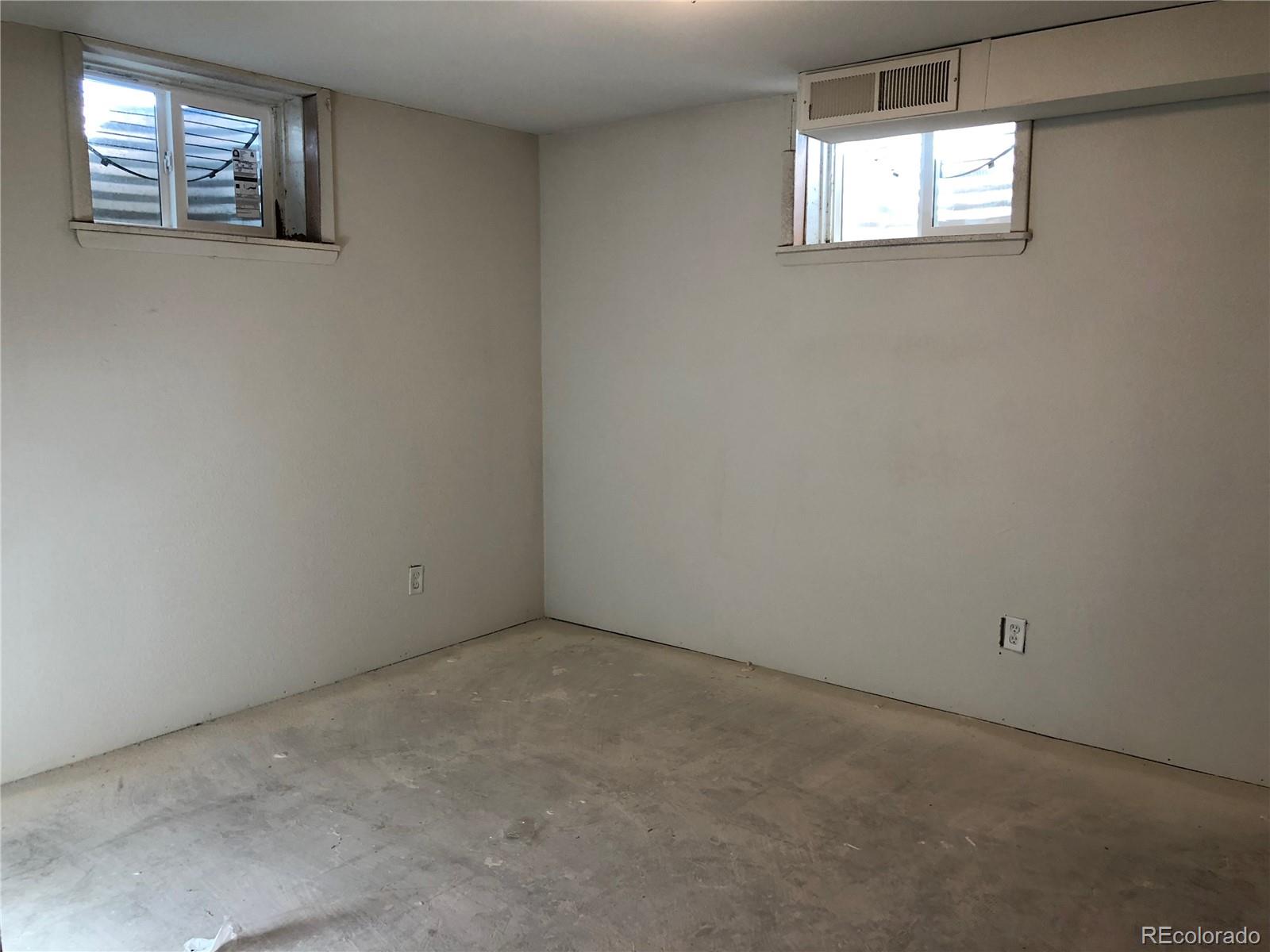 39592 County Road 18 Roggen, CO 80652 - Photo 27 of 34 an empty room with windows