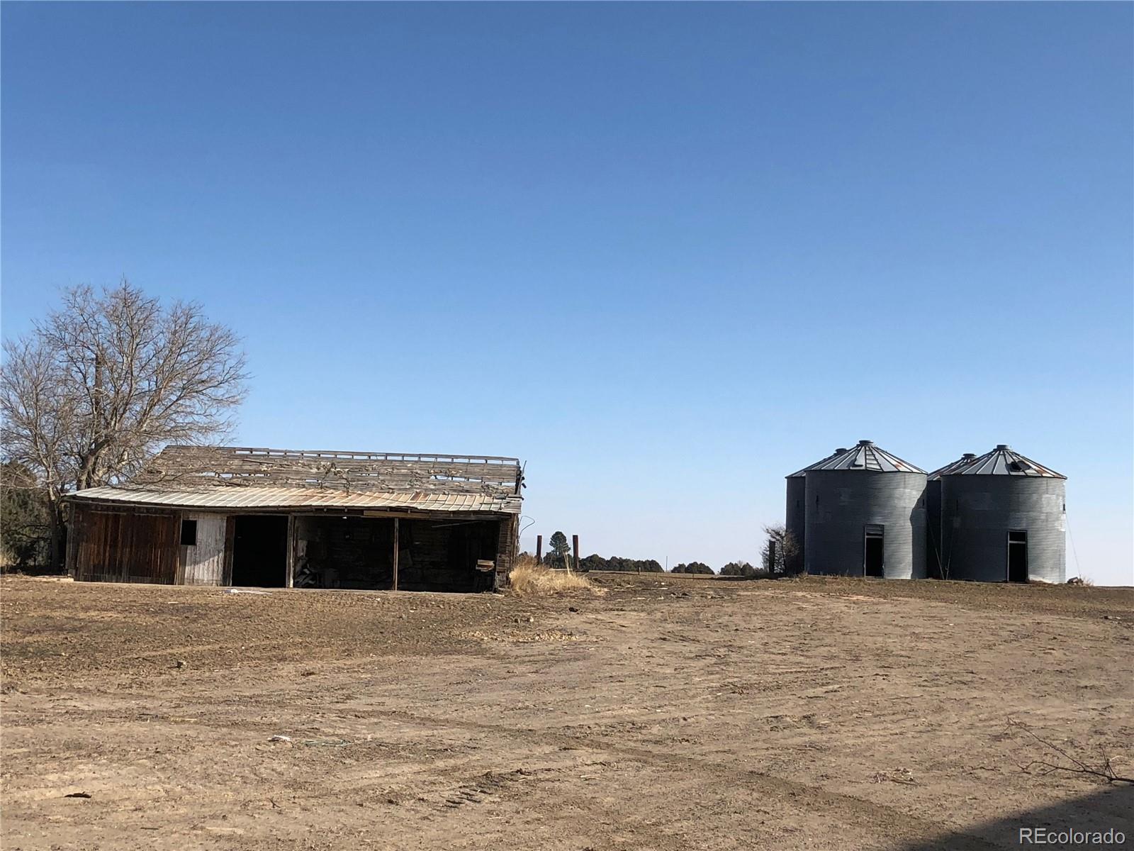 39592 County Road 18 Roggen, CO 80652 - Photo 30 of 34 a front view of a house with a yard