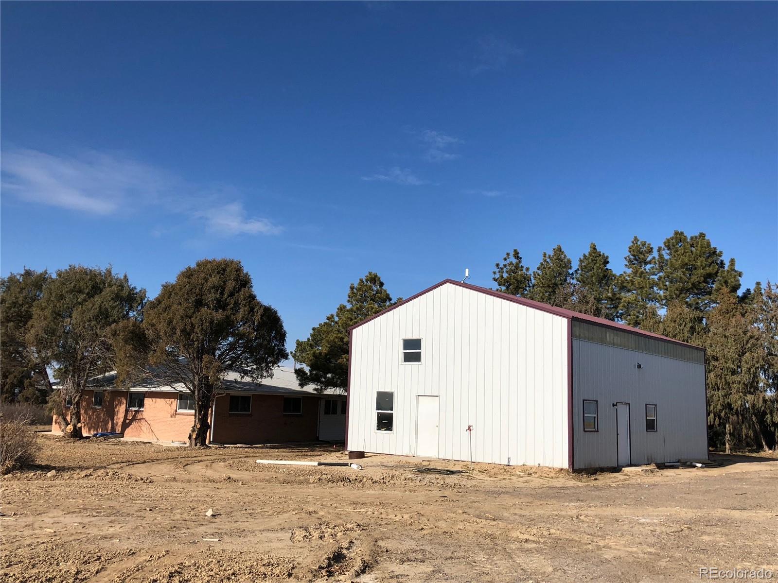 39592 County Road 18 Roggen, CO 80652 - Photo 31 of 34 a view of a house with a snow