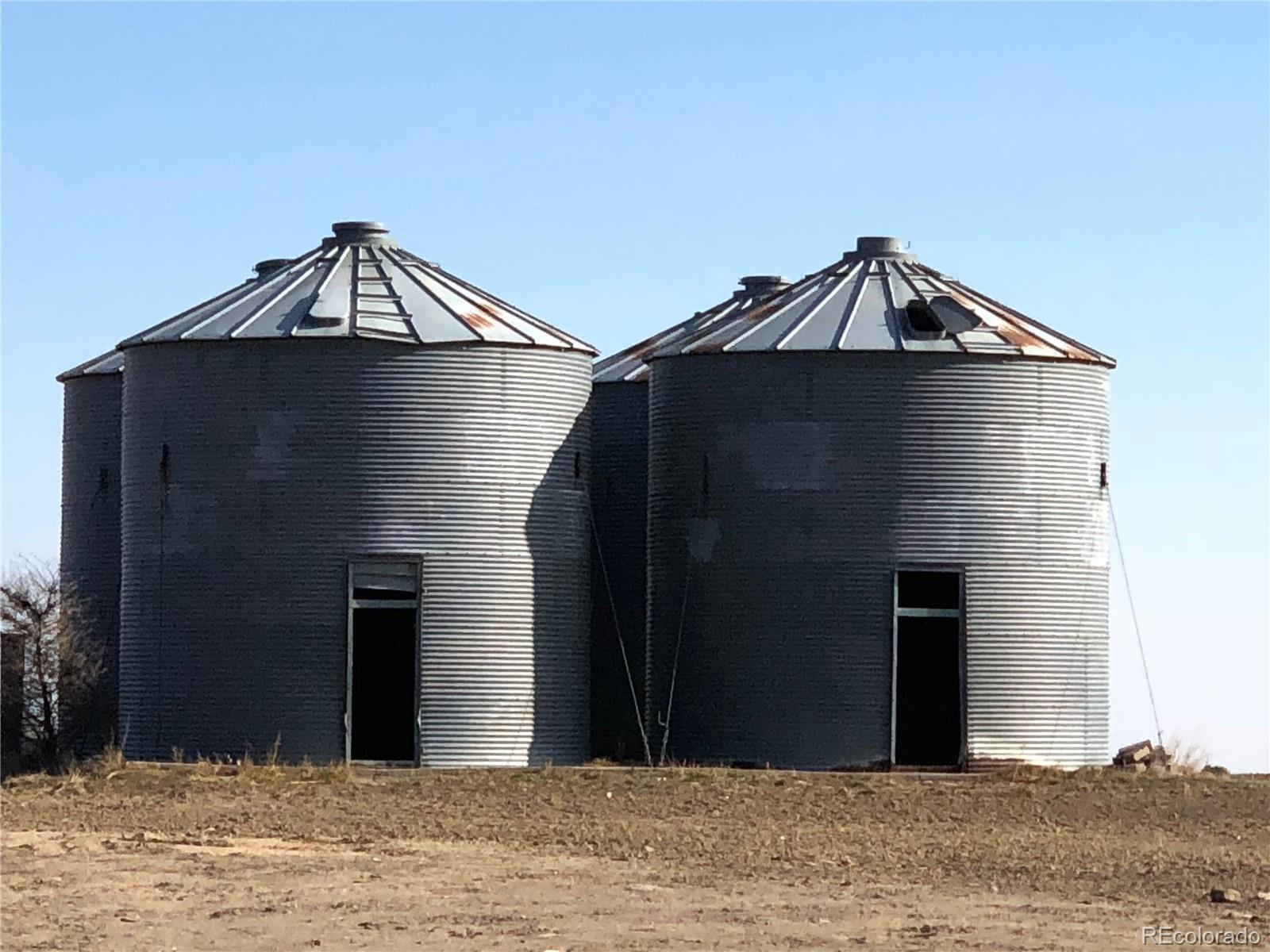 39592 County Road 18 Roggen, CO 80652 - Photo 32 of 34 a front view of a house with a yard