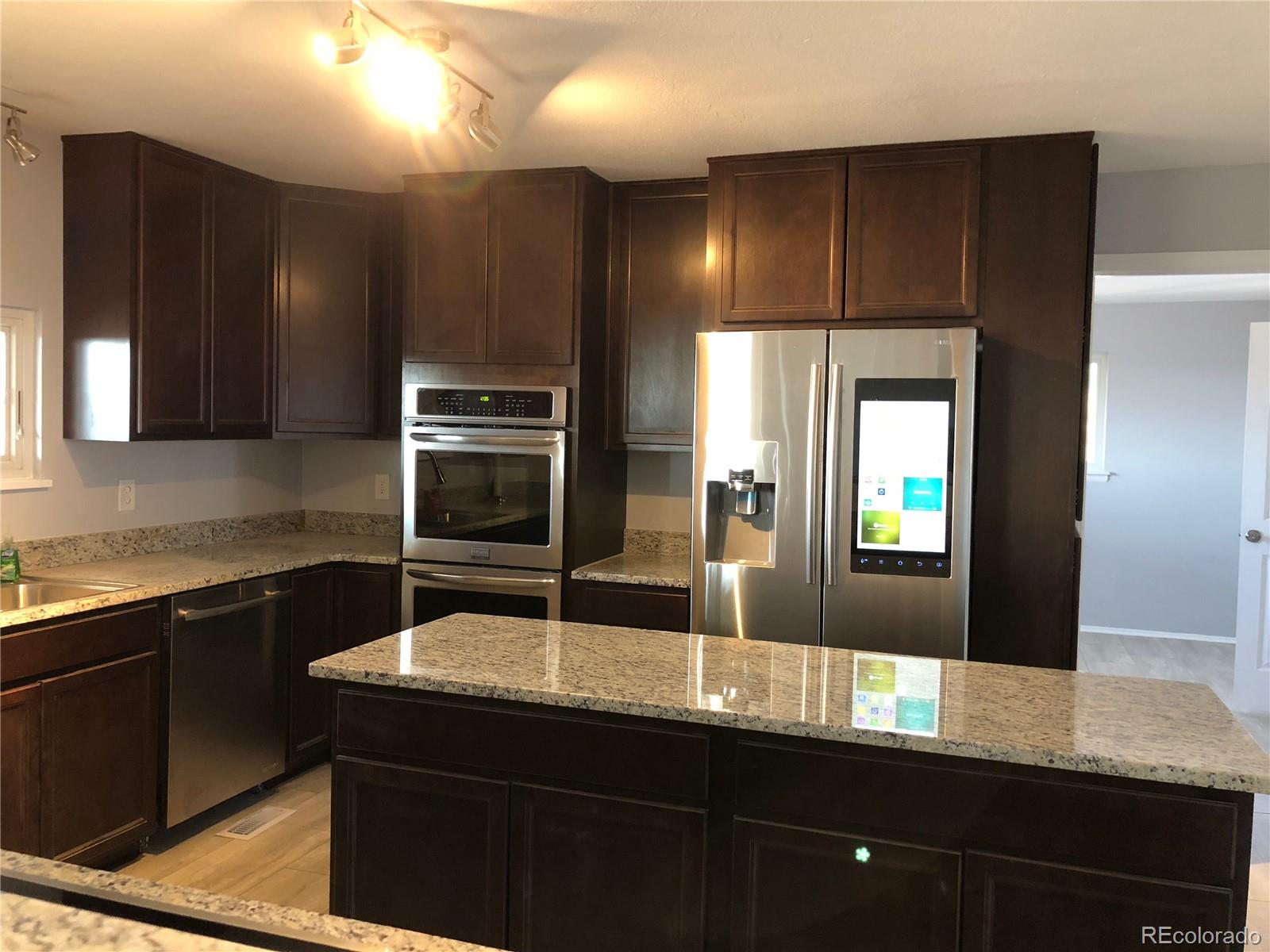 39592 County Road 18 Roggen, CO 80652 - Photo 5 of 34 a kitchen with a sink and cabinets