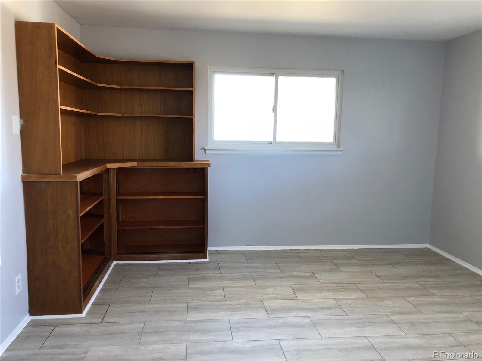 39592 County Road 18 Roggen, CO 80652 - Photo 9 of 34 a view of walk in closet with empty racks