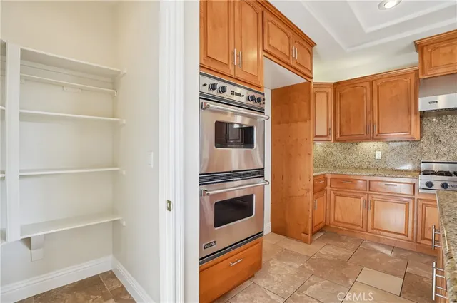 a view of an empty room with a bathroom