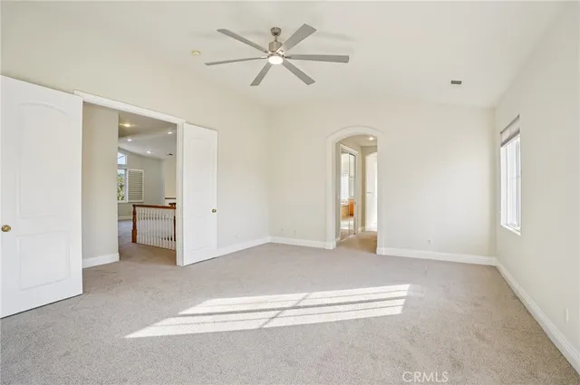 a spacious bathroom with a granite countertop sink a toilet and bathtub